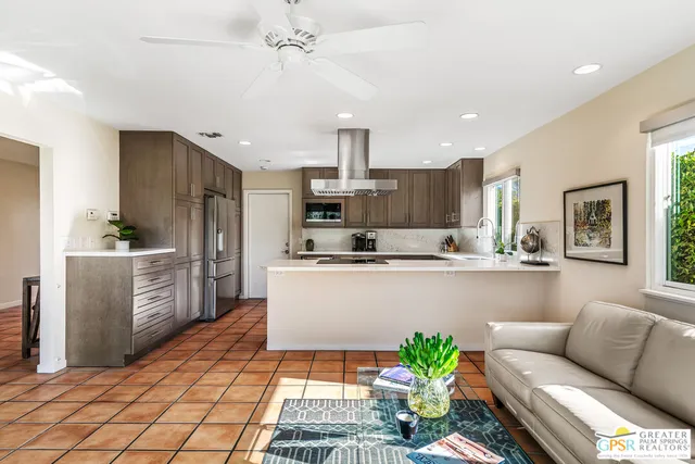 a kitchen with a stove a sink and cabinets