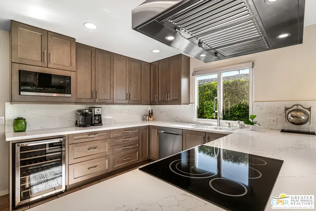 a large bed sitting in a bedroom and lamp