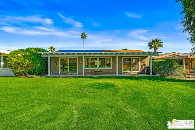 an aerial view of a houses with a outdoor space