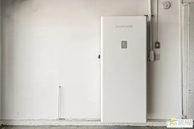 an aerial view of a house with garden space and street view