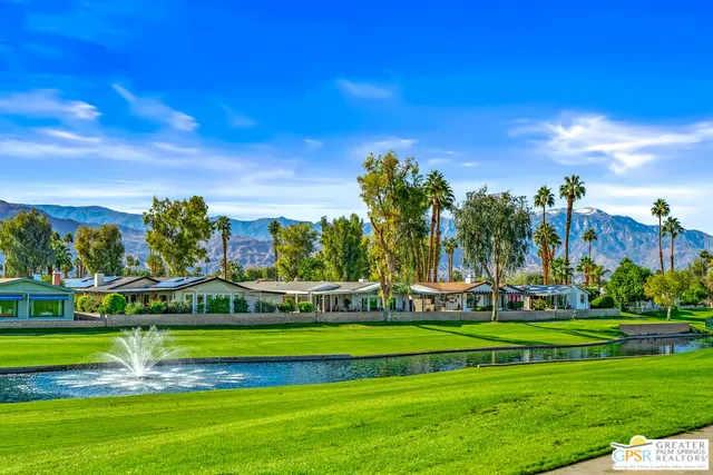 a view of a city with mountains in the background