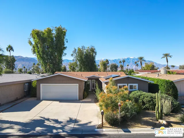 a view of a swimming pool with a yard