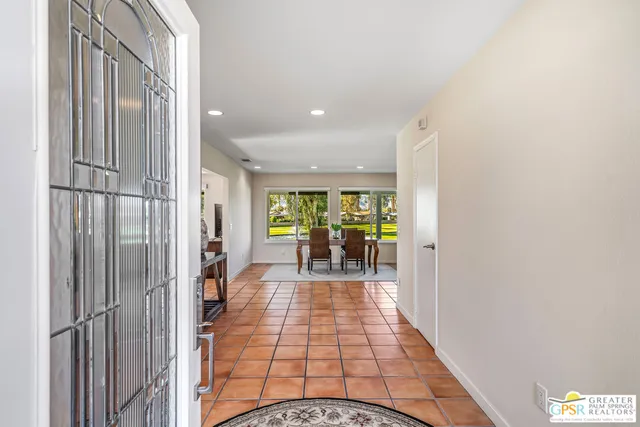 a view of a dining room with furniture window and outside view