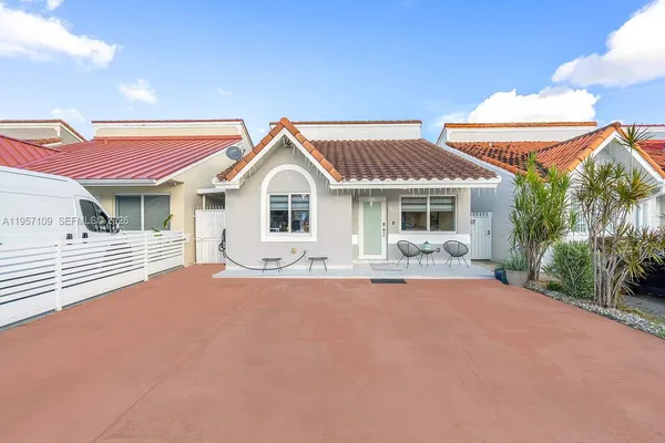 a front view of a house with a yard and porch