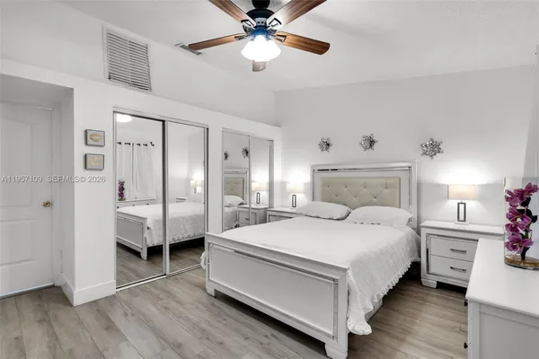 a bedroom with a bed and a closet