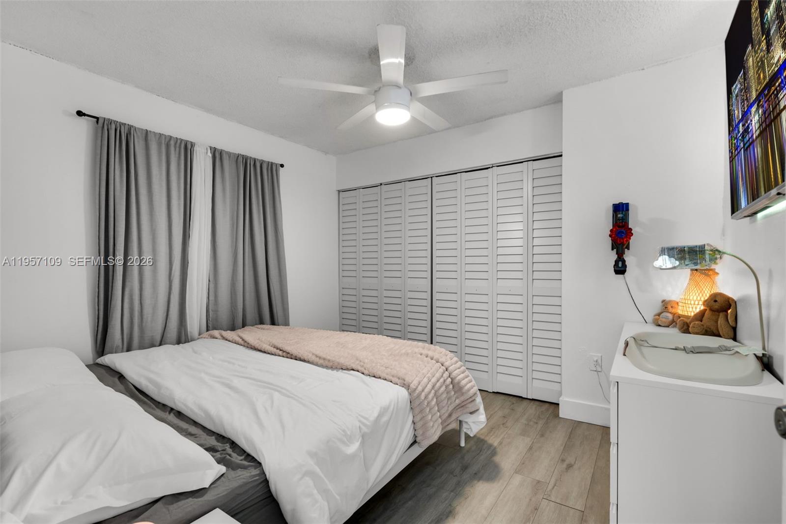 7531 West 29th Way, Unit 7531 Hialeah, FL 33018 - Photo 20 of 30 a bedroom with a bed and a storage
