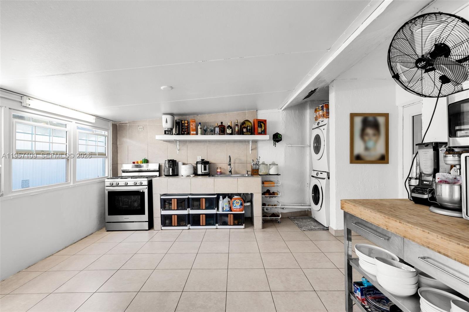 7531 West 29th Way, Unit 7531 Hialeah, FL 33018 - Photo 23 of 30 a view of a living room kitchen and a window