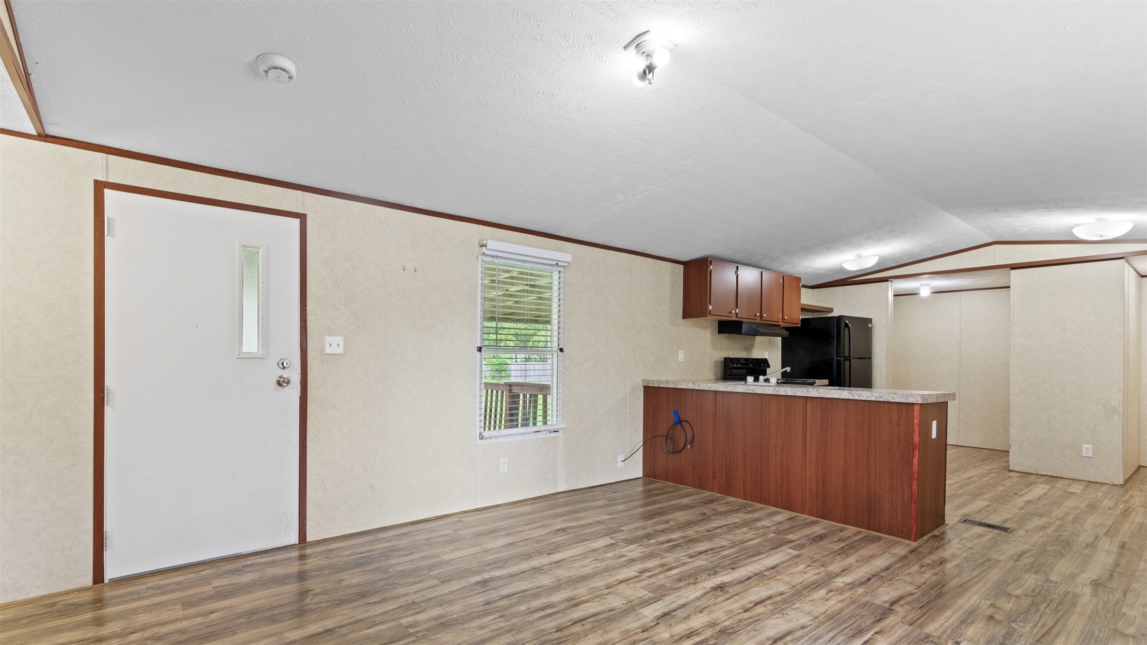91 Maple Lane Shepherd, TX 77371 - Photo 2 of 15 a view of a kitchen with wooden floor and electronic appliances