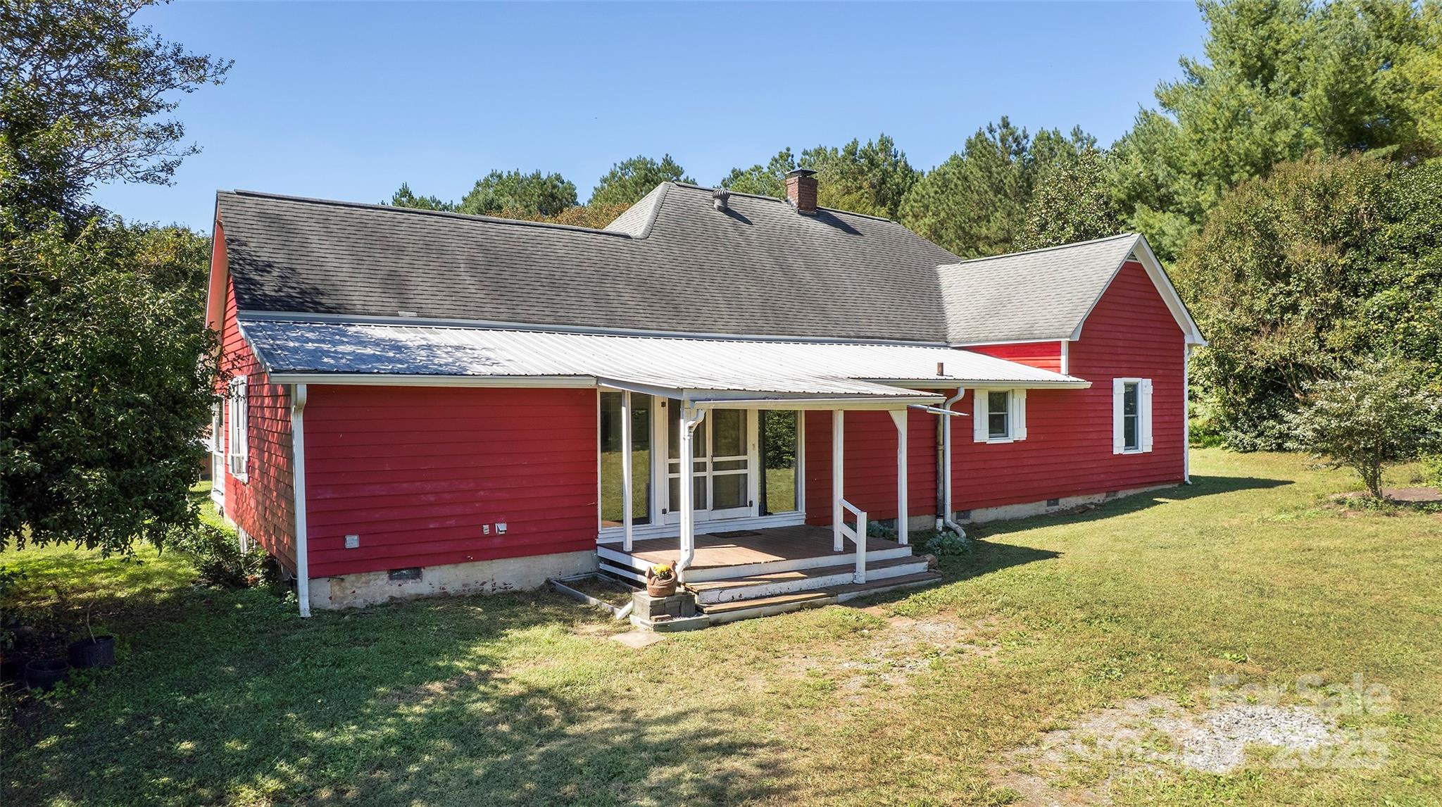 8430 Reeps Grove Church Road Vale, NC 28168 - Photo 2 of 42 a view of a house with a yard patio and fire pit