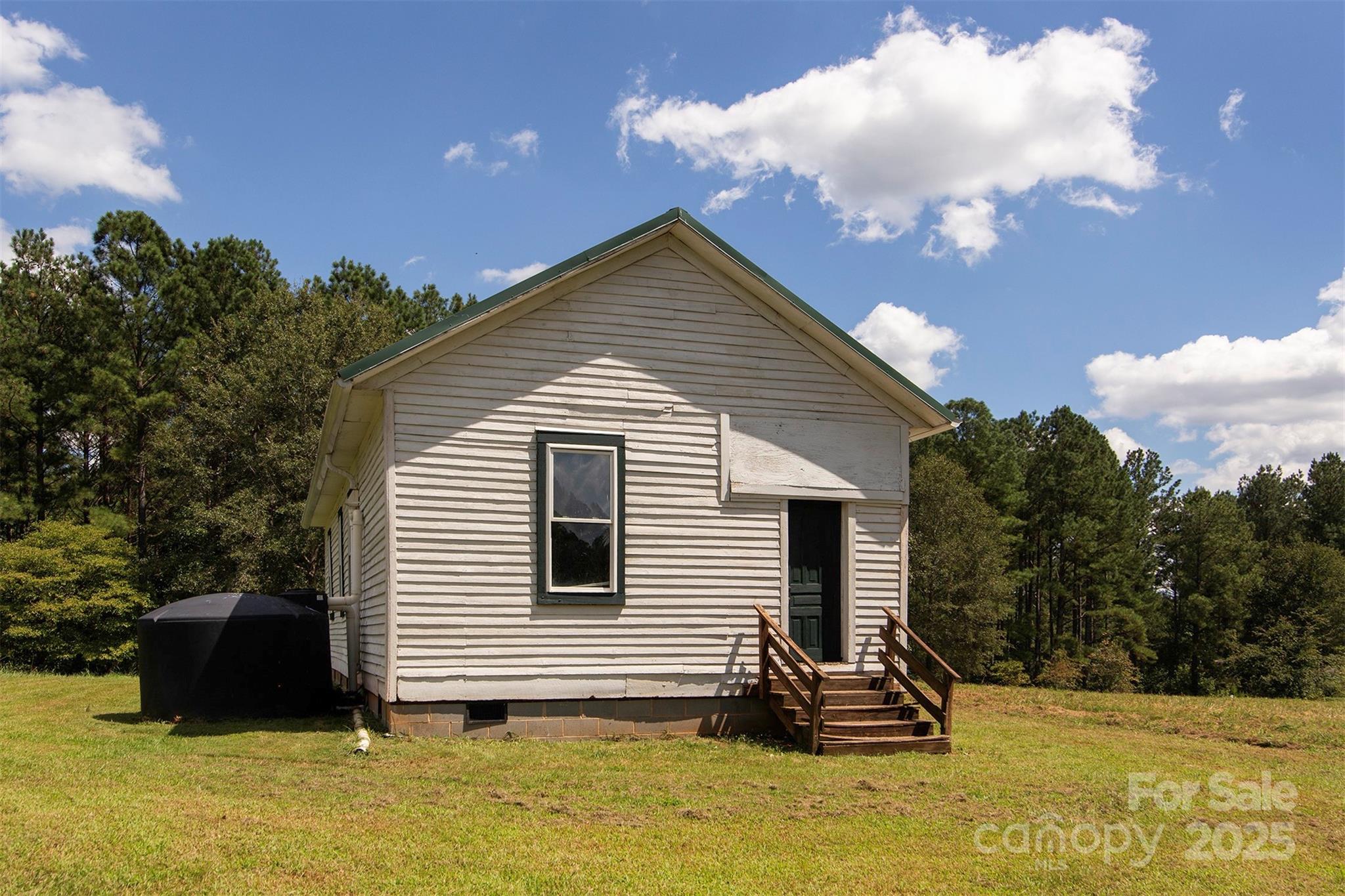 8430 Reeps Grove Church Road Vale, NC 28168 - Photo 35 of 42 a view of a house with a yard