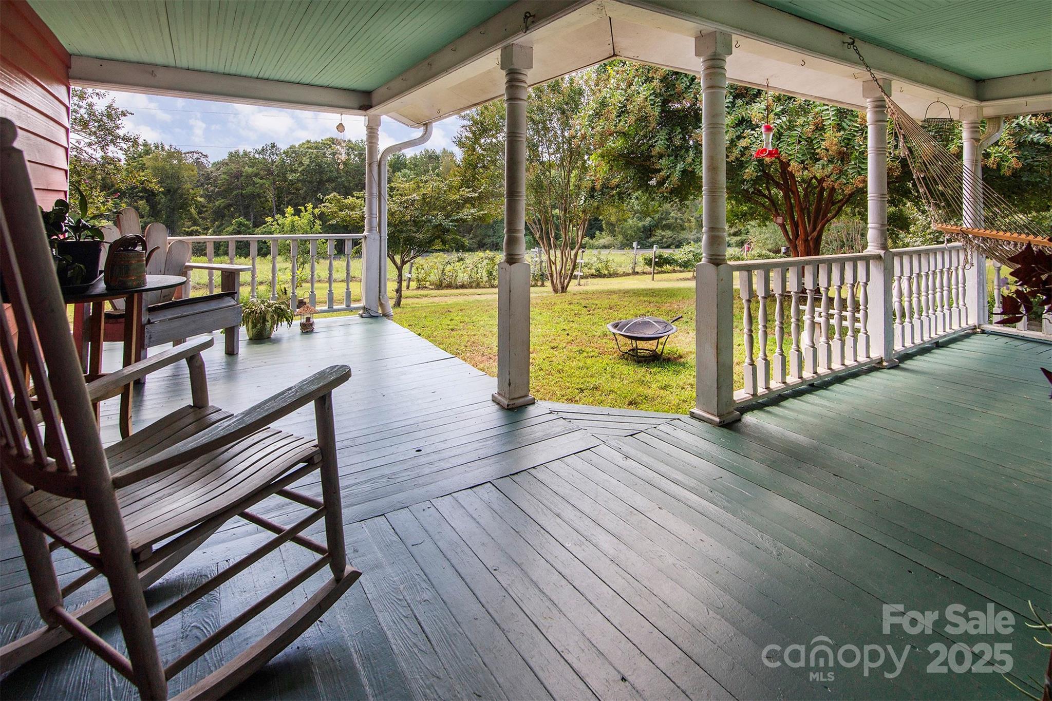 8430 Reeps Grove Church Road Vale, NC 28168 - Photo 5 of 42 a view of a balcony with chairs and wooden floor