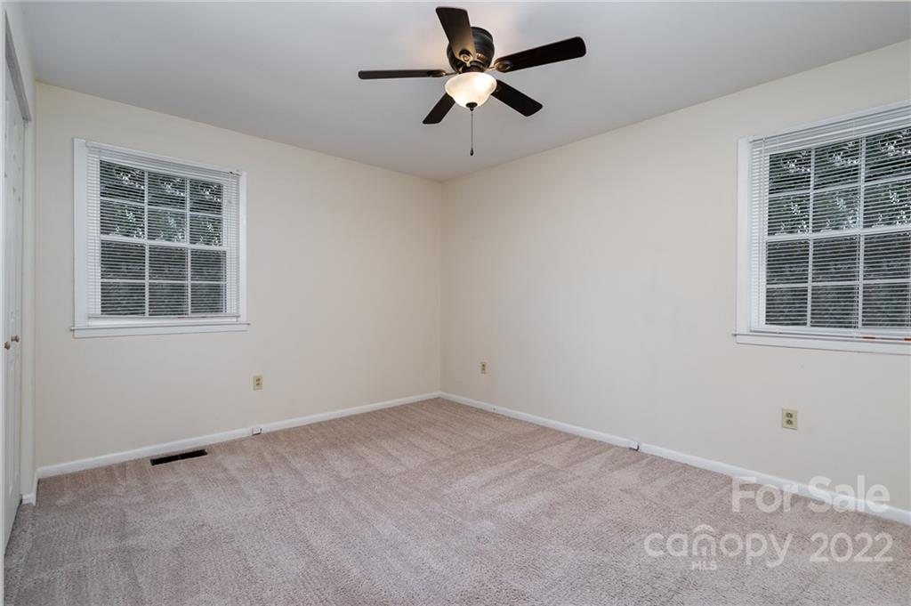 1500 Rama Road Charlotte, NC 28211 - Photo 15 of 25 an empty room with windows and fan