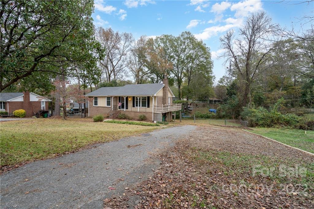1500 Rama Road Charlotte, NC 28211 - Photo 2 of 25 a front view of a house with a yard and trees