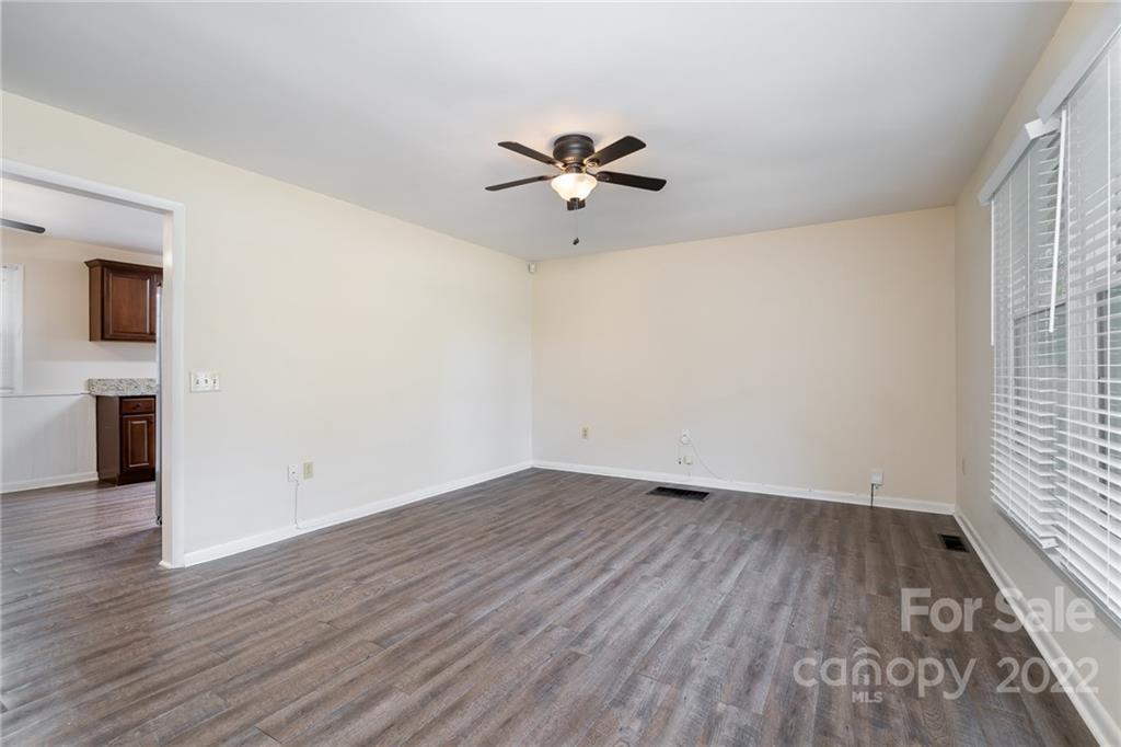 1500 Rama Road Charlotte, NC 28211 - Photo 4 of 25 wooden floor in an empty room with a window