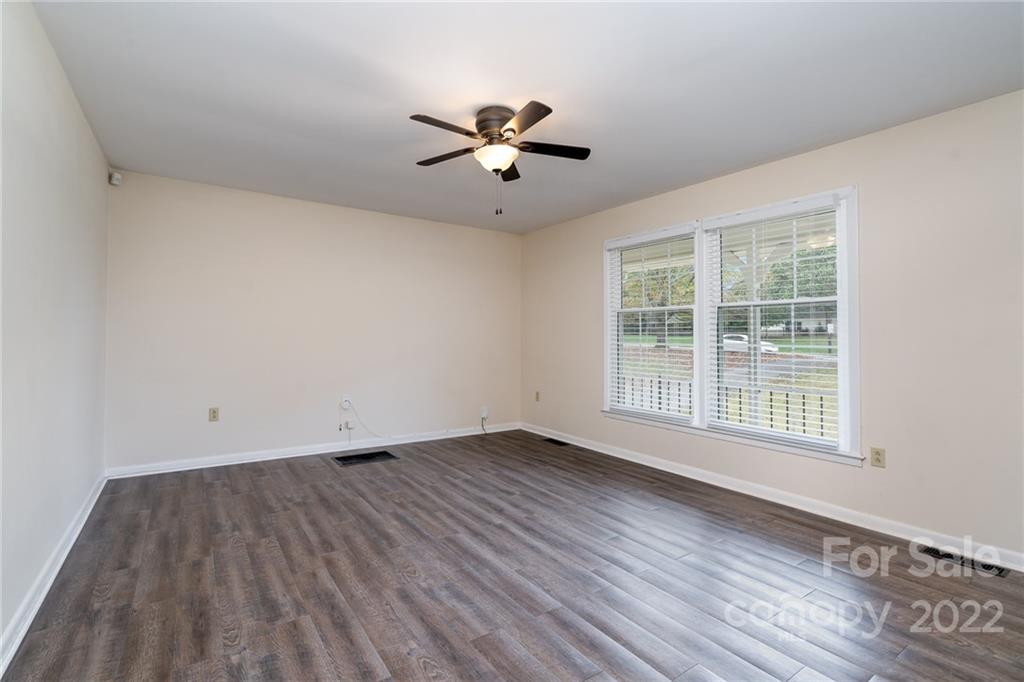1500 Rama Road Charlotte, NC 28211 - Photo 5 of 25 a view of empty room with wooden floor and fan