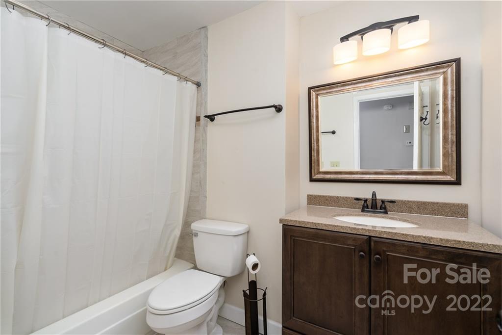 1500 Rama Road Charlotte, NC 28211 - Photo 10 of 25 a bathroom with a toilet sink and mirror