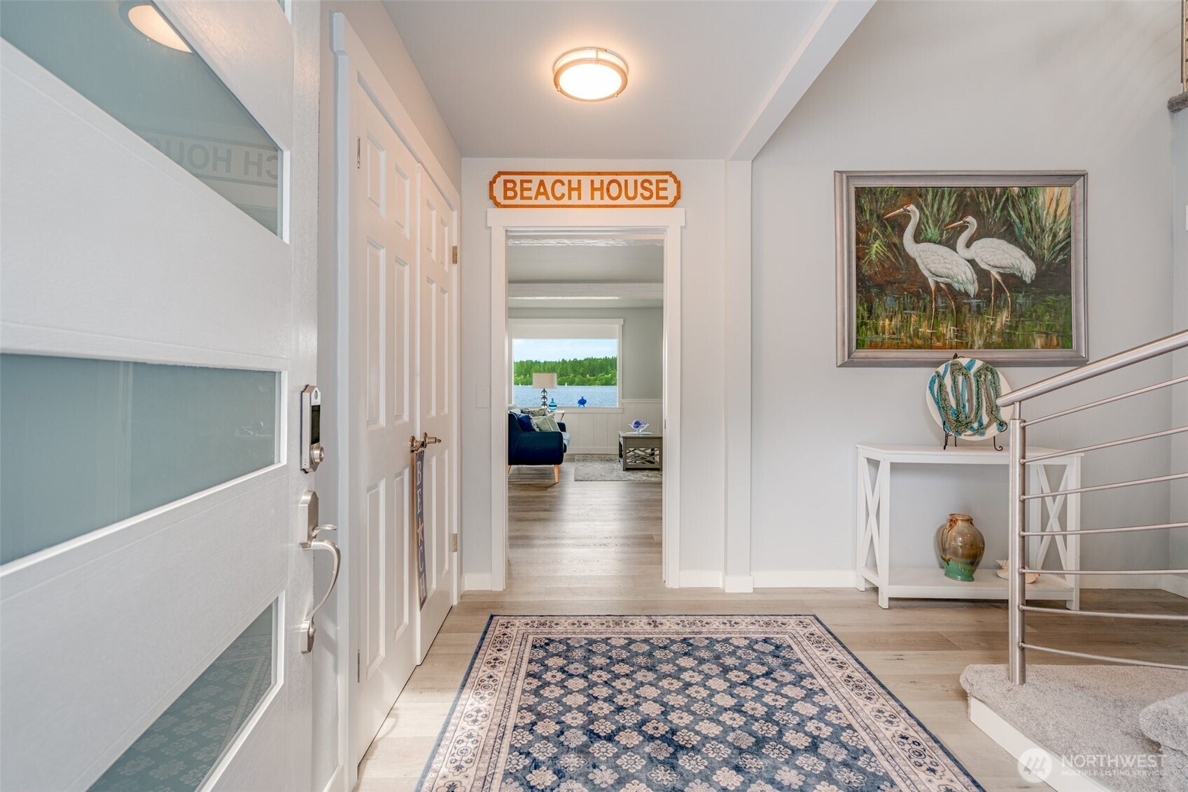 5341 South Bercot Road Freeland, WA 98249 - Photo 7 of 37 a view of a hallway with wooden floor and furniture