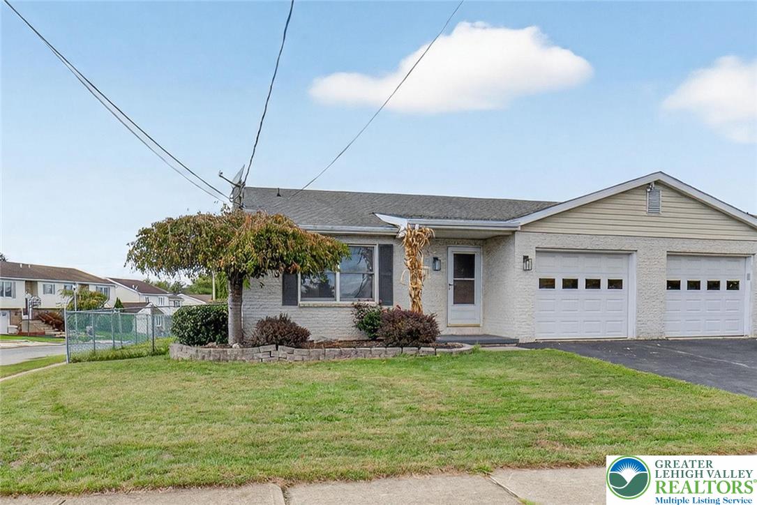 1026 Oak Street Coplay, PA 18037 - Photo 1 of 27 a front view of a house with garden