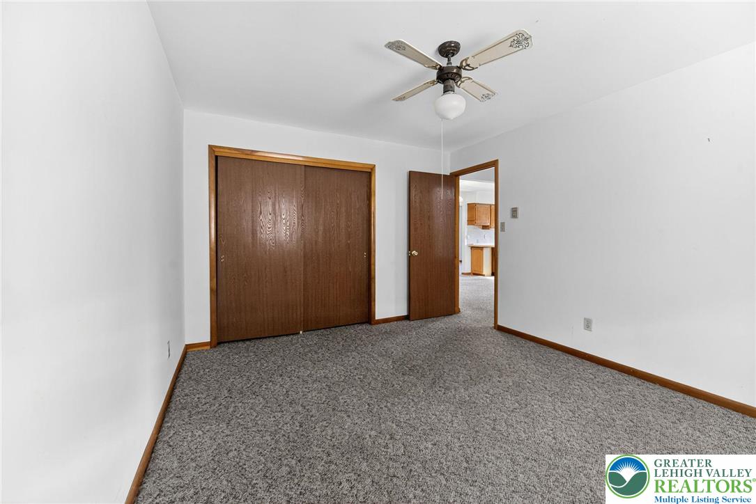 1026 Oak Street Coplay, PA 18037 - Photo 13 of 27 an empty room with fan and windows
