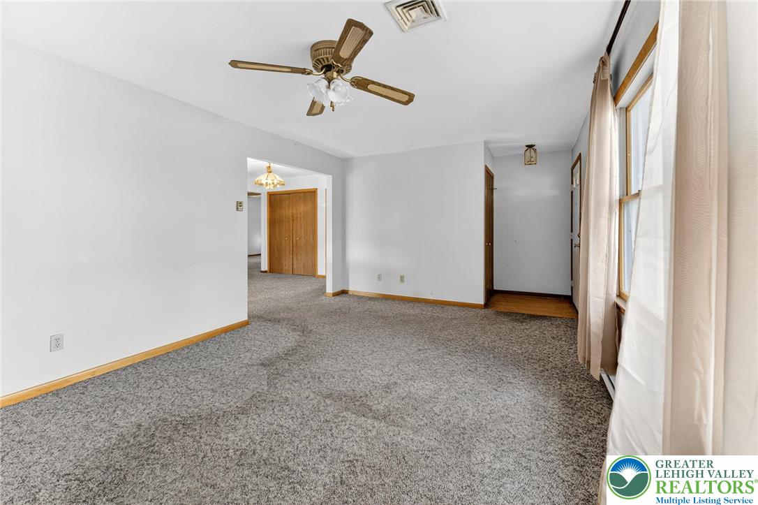 1026 Oak Street Coplay, PA 18037 - Photo 6 of 27 a view of a livingroom with a ceiling fan and window