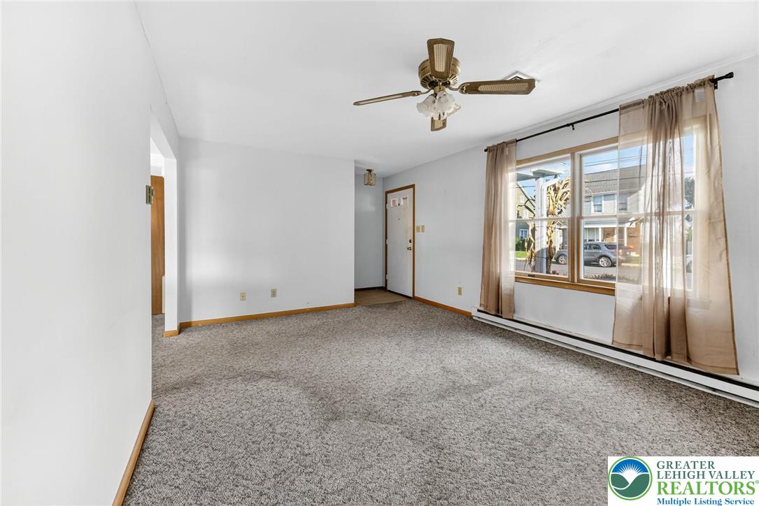 1026 Oak Street Coplay, PA 18037 - Photo 7 of 27 a view of a livingroom with a ceiling fan and window