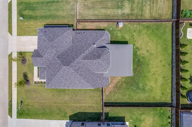 a aerial view of a house with a yard