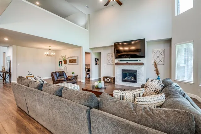 a living room with fireplace furniture and a flat screen tv