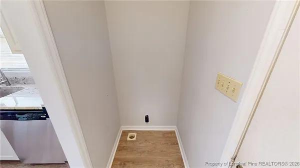 a view of utility room with a sink