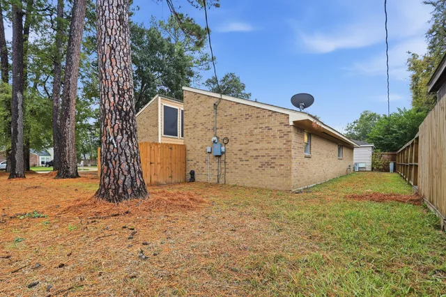 a view of a backyard of the house