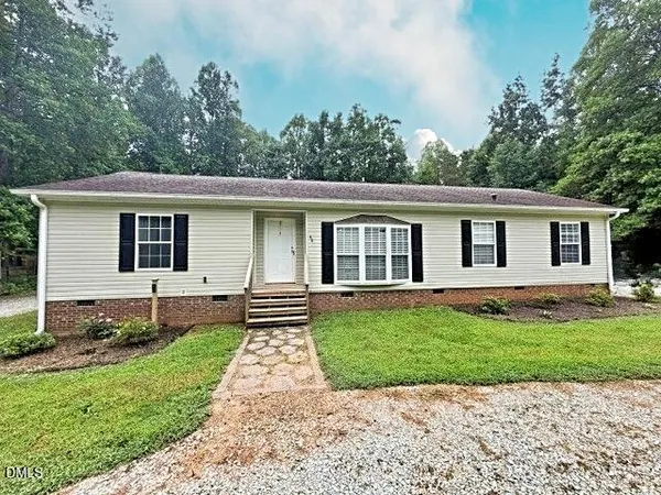 a front view of a house with a yard and porch