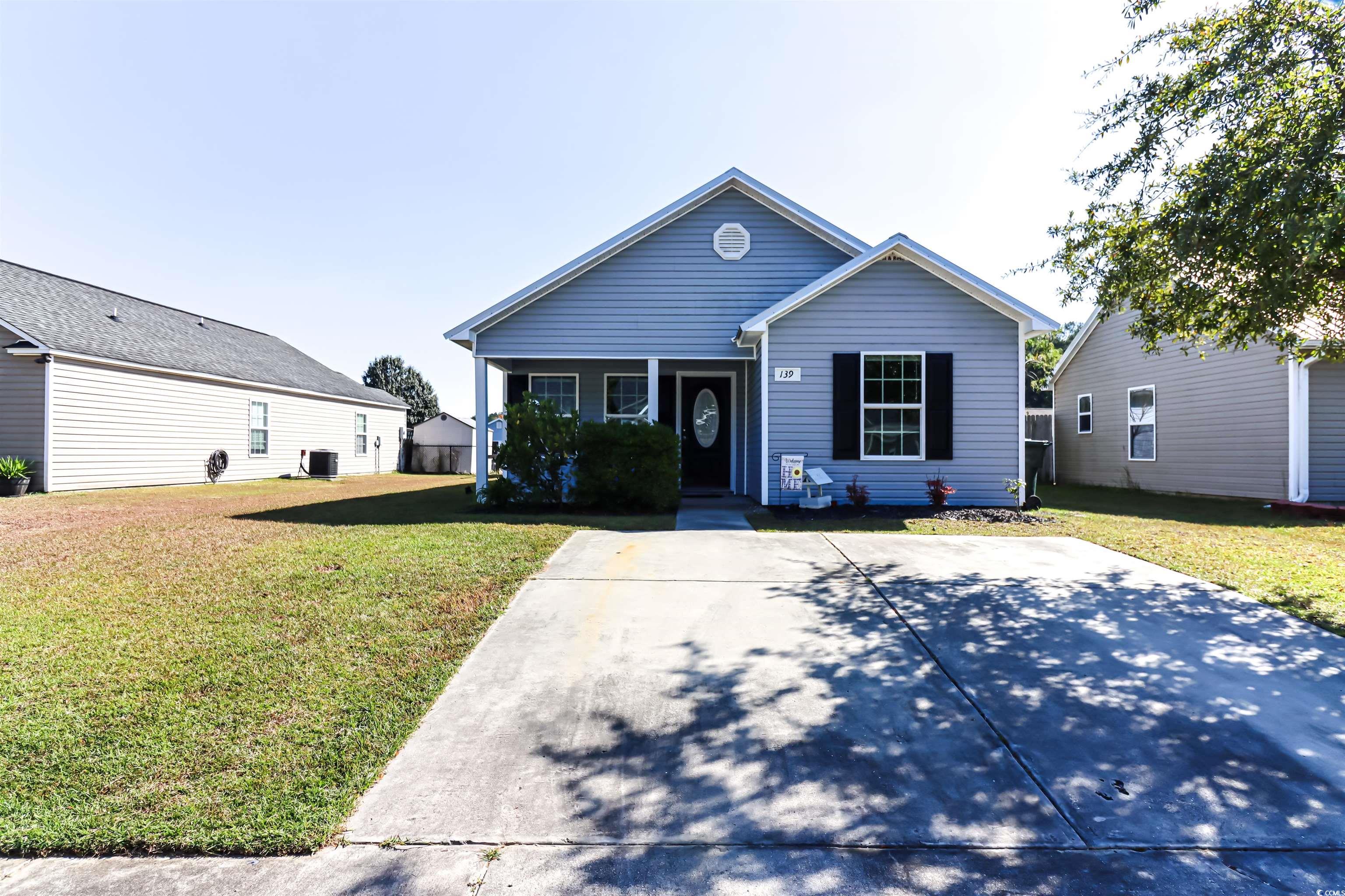 View of front of house with a front yard