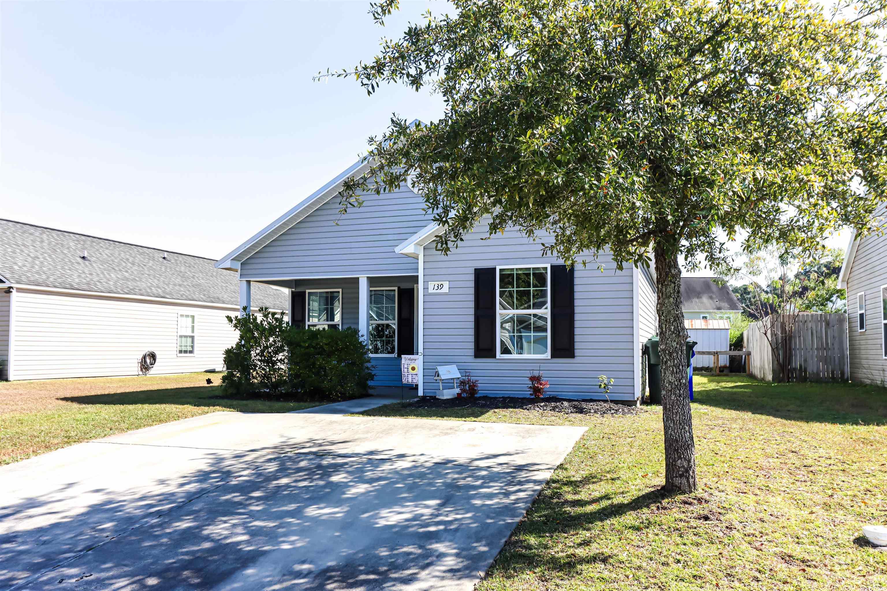 View of front of property featuring a front lawn