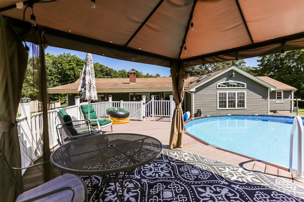 659 Tinkham Road Wilbraham, MA 01095 - Photo 32 of 35 a view of a house with backyard sitting area and backyard