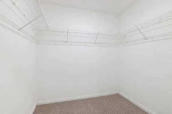 a view of a room with racks on the wall