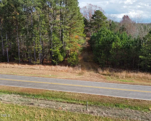 a view of a yard and car parked
