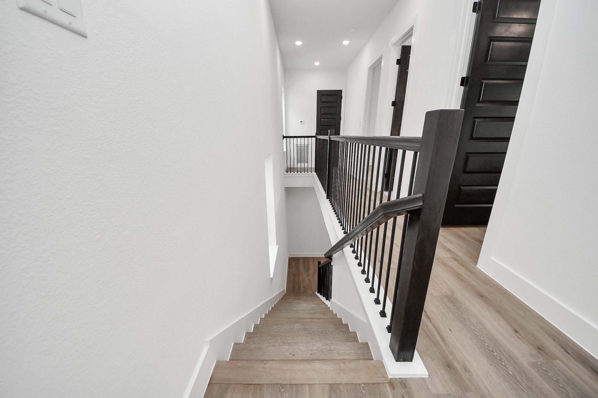 3308 Hardy Street Houston, TX 77009 - Photo 13 of 31 a view of a hallway with staircase