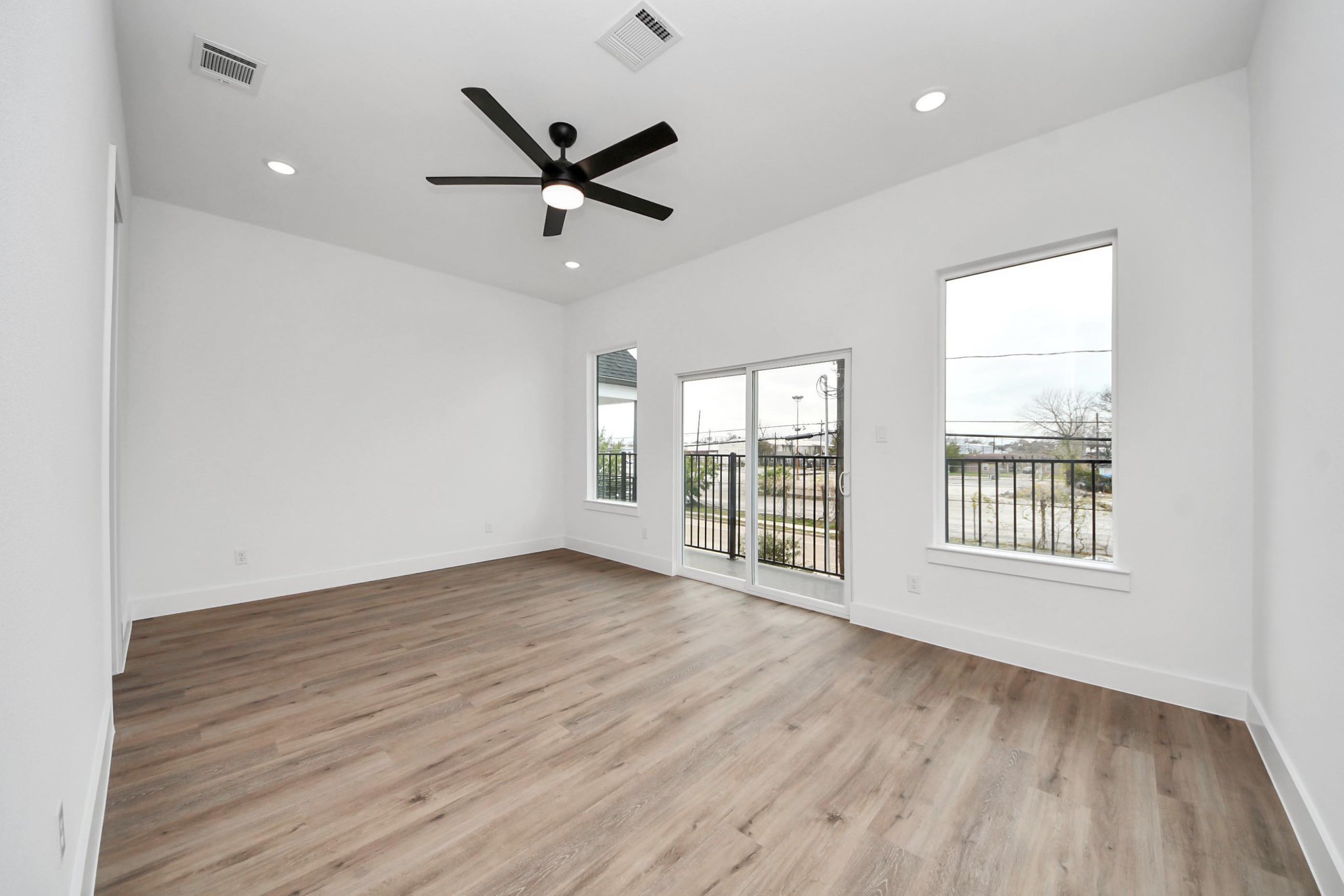 3308 Hardy Street Houston, TX 77009 - Photo 15 of 31 a view of an empty room with wooden floor and a window