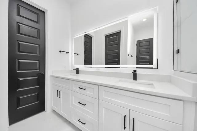a bathroom with a sink and a mirror