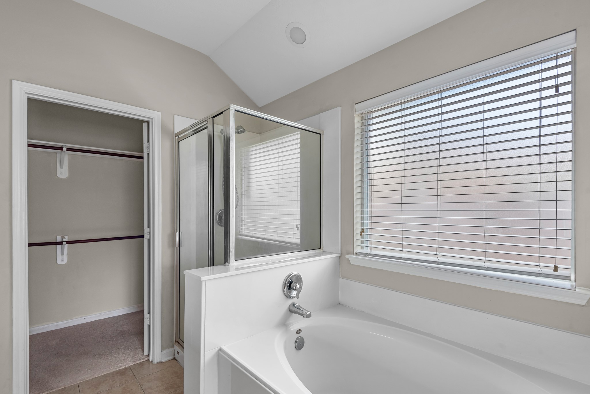 8514 Sweetstone Field Court Cypress, TX 77433 - Photo 18 of 23 a bathroom with a bathtub and a shower