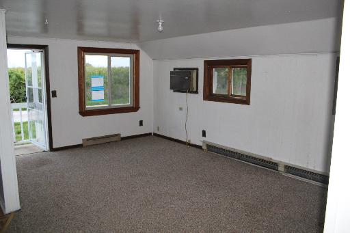 4762 East 2351st Road Somonauk, IL 60552 - Photo 2 of 8 an empty room with windows
