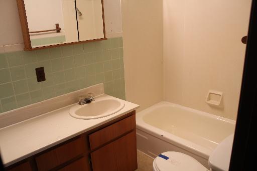 4762 East 2351st Road Somonauk, IL 60552 - Photo 5 of 8 a bathroom with a sink a toilet and vanity