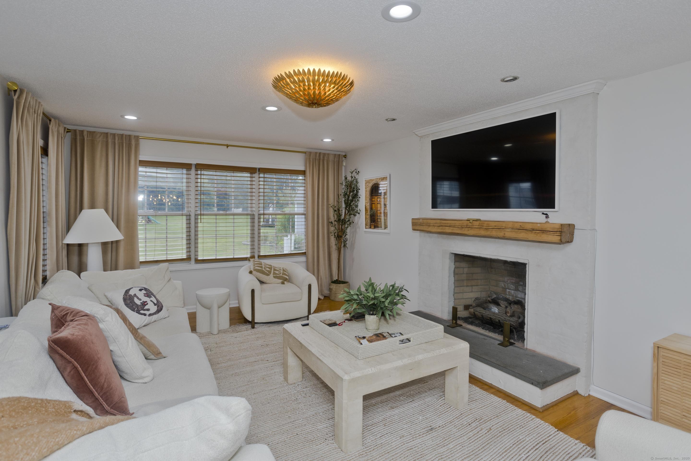 120 Scenic View Drive Middletown, CT 06457 - Photo 1 of 24 a living room with furniture and a fireplace
