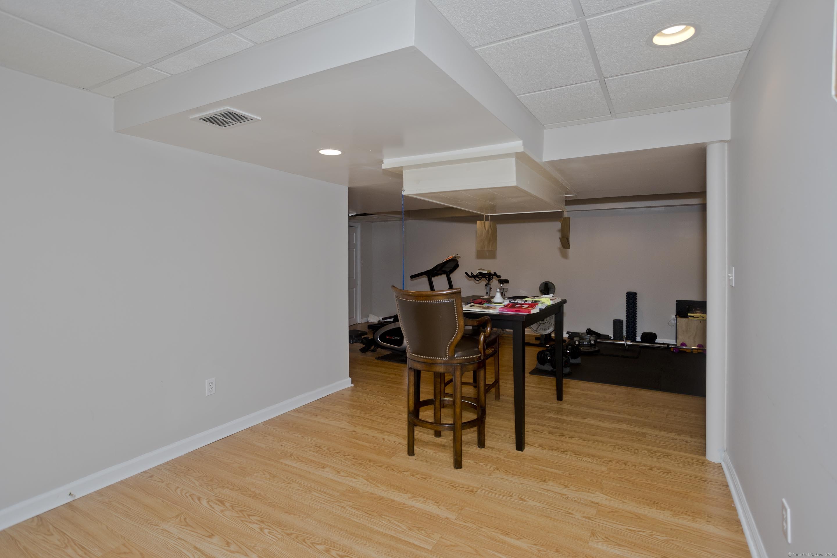 120 Scenic View Drive Middletown, CT 06457 - Photo 15 of 24 a dining room with furniture and a wooden floor