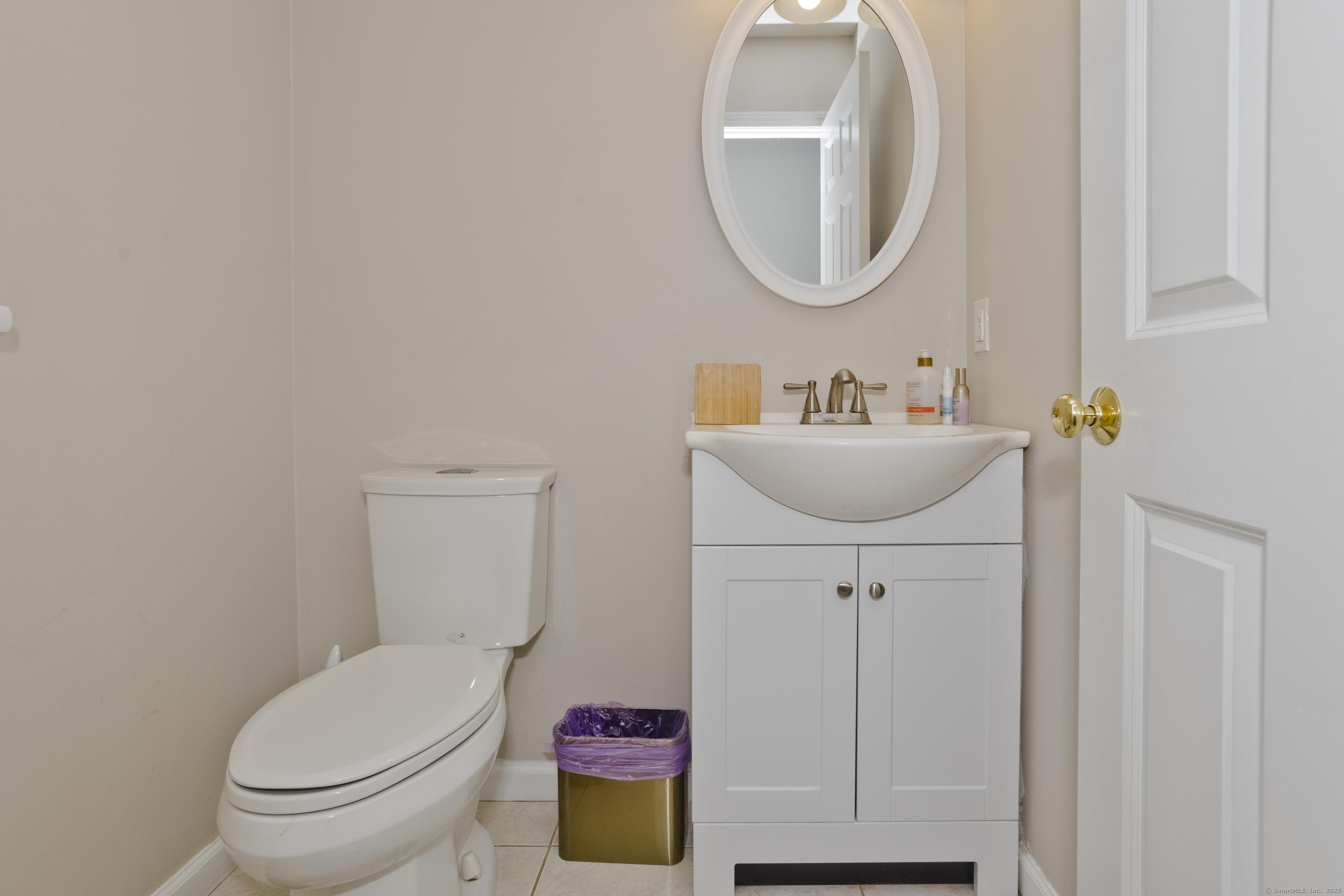 120 Scenic View Drive Middletown, CT 06457 - Photo 7 of 24 a bathroom with a toilet a sink and mirror