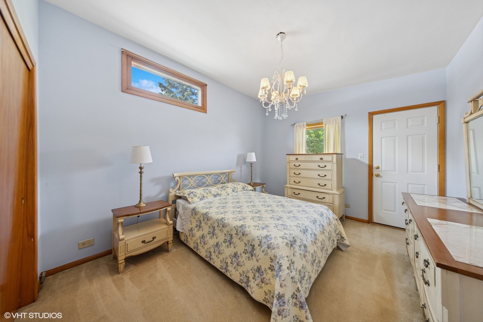 506 South Charleton Street Willow Springs, IL 60480 - Photo 11 of 21 a bedroom with a bed and a chandelier