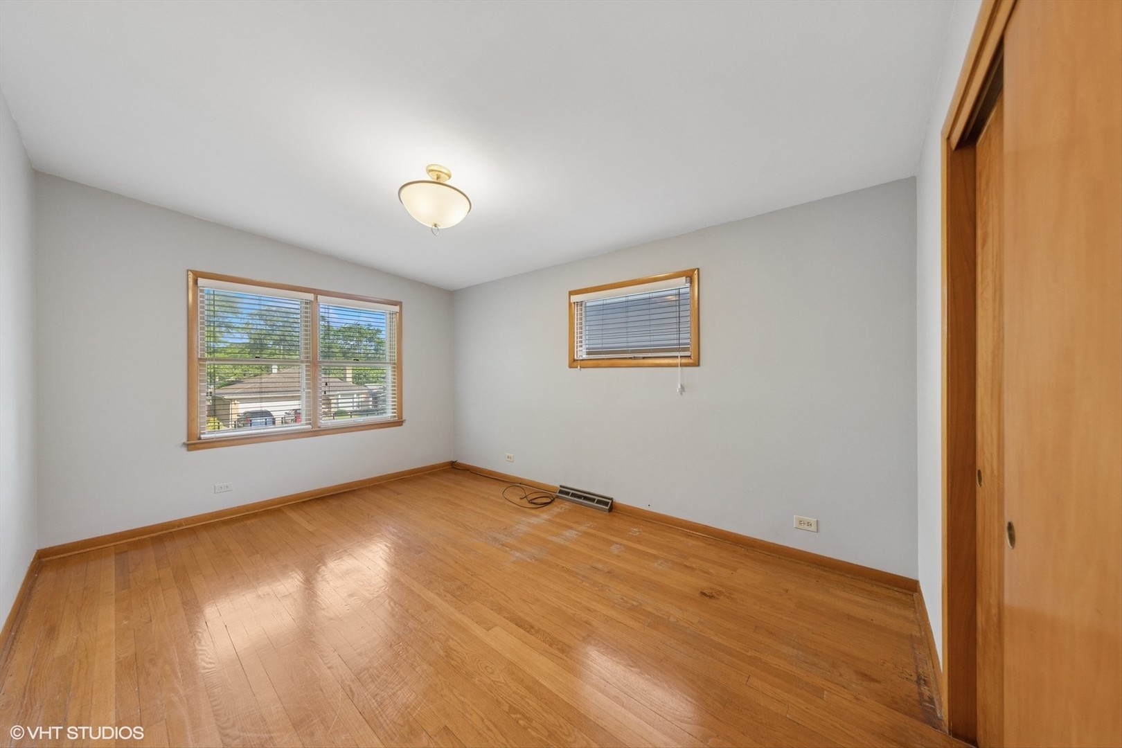 506 South Charleton Street Willow Springs, IL 60480 - Photo 13 of 21 a view of an empty room with window and wooden floor