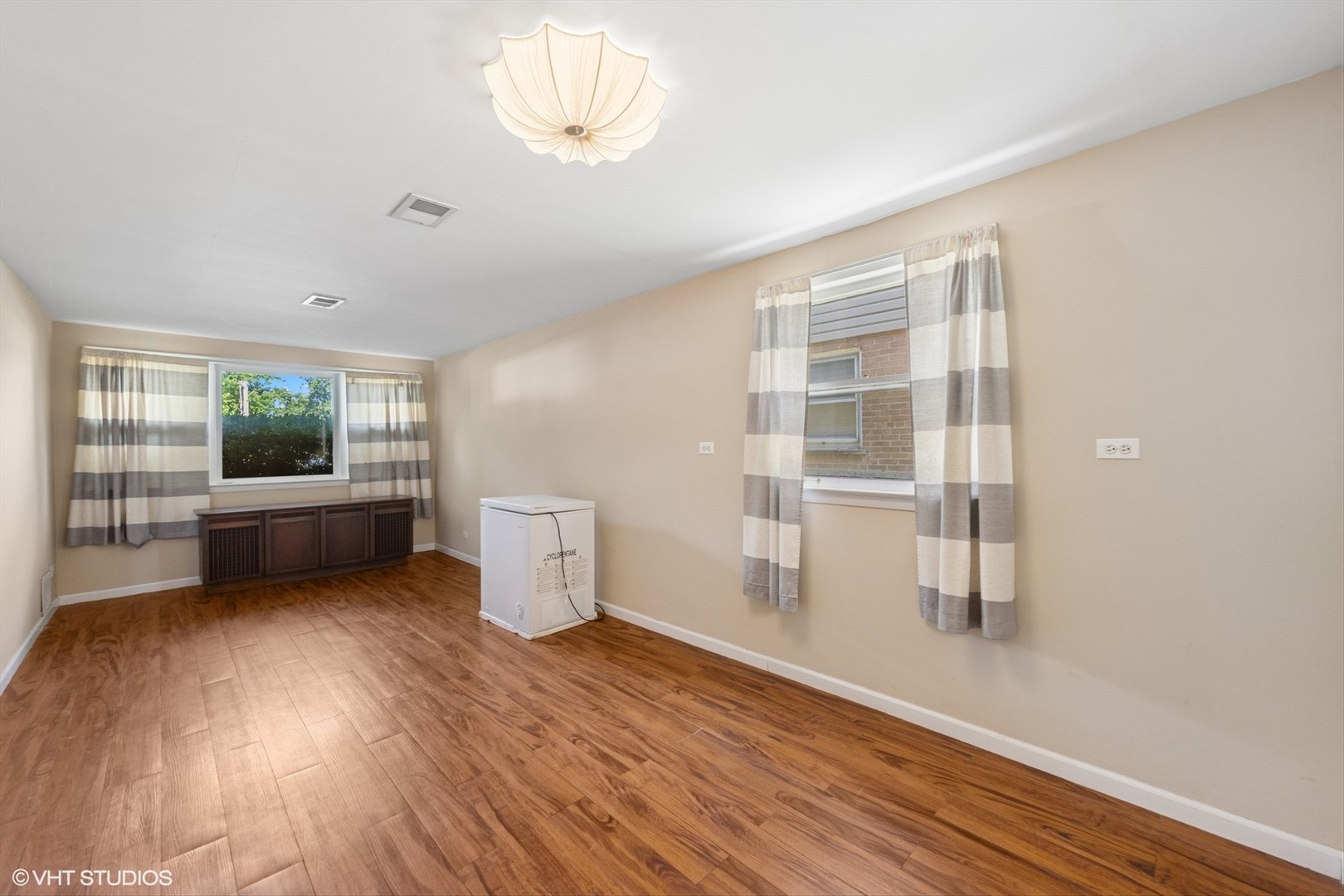 506 South Charleton Street Willow Springs, IL 60480 - Photo 16 of 21 a view of an empty room with a window and wooden floor