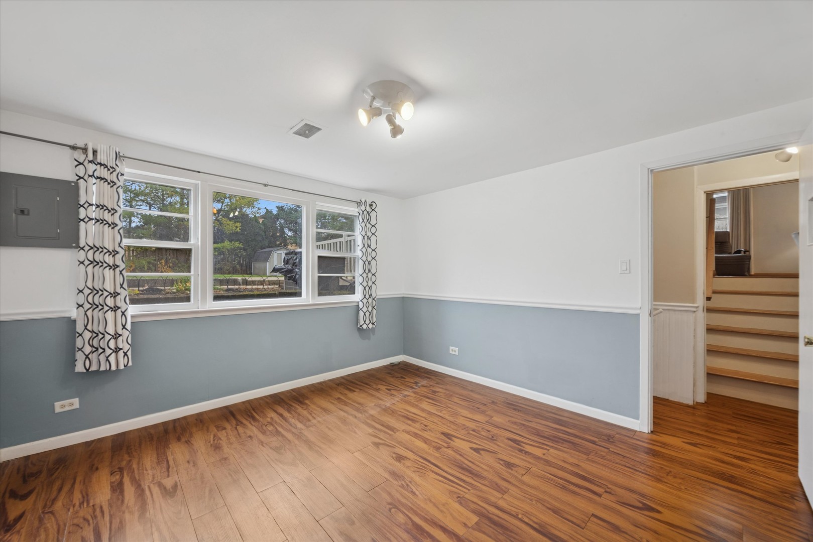 506 South Charleton Street Willow Springs, IL 60480 - Photo 17 of 21 a view of empty room with wooden floor and fan