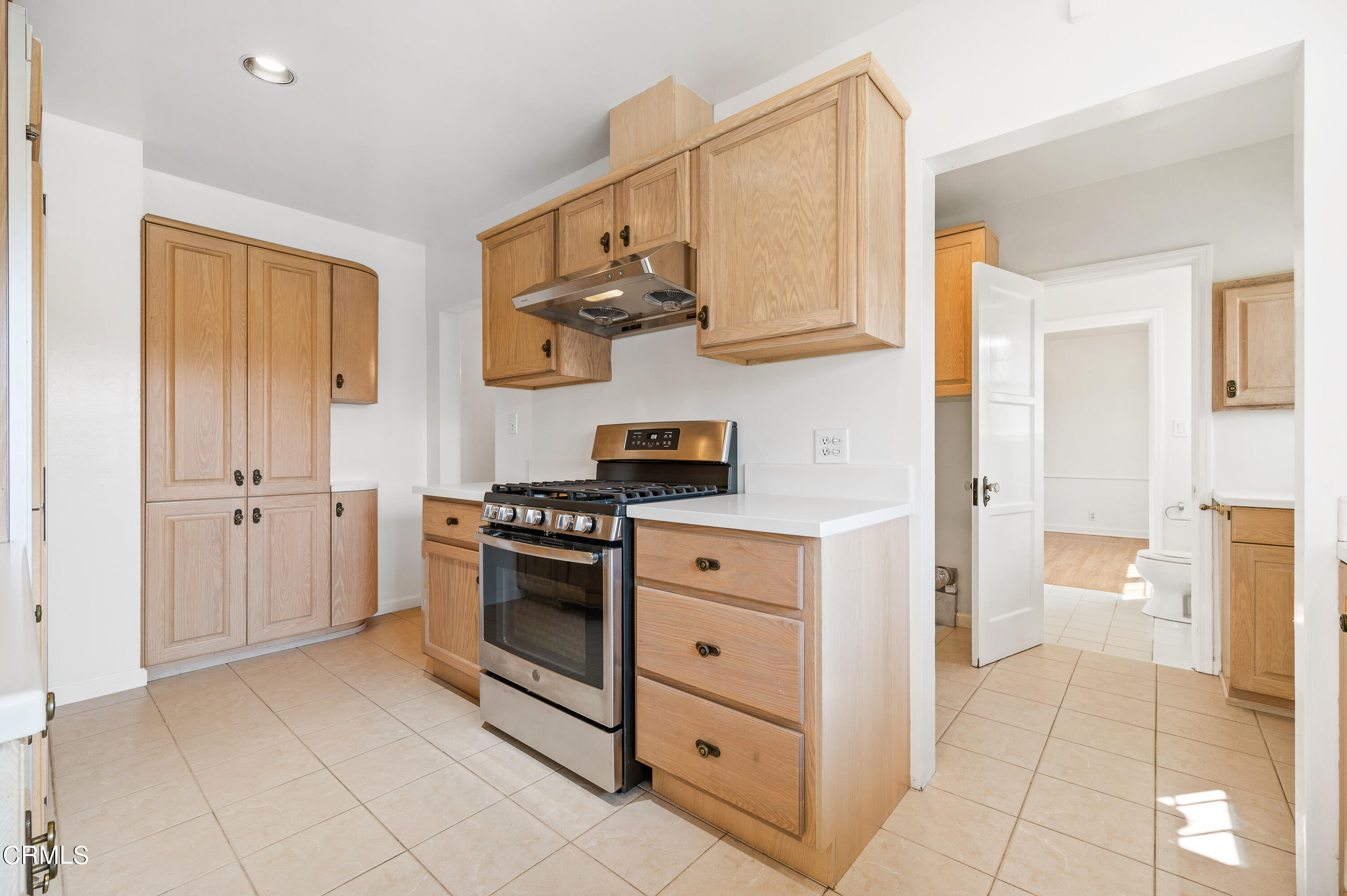 517 St Albans Road San Gabriel, CA 91775 - Photo 11 of 24 a kitchen with stainless steel appliances granite countertop a refrigerator and a stove top oven