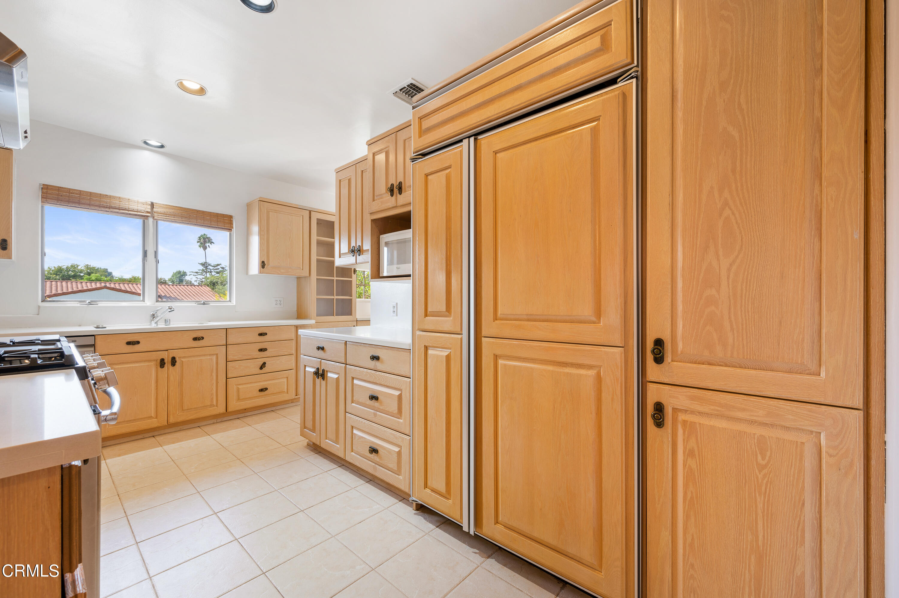 517 St Albans Road San Gabriel, CA 91775 - Photo 12 of 24 a kitchen with stainless steel appliances a refrigerator sink and cabinets